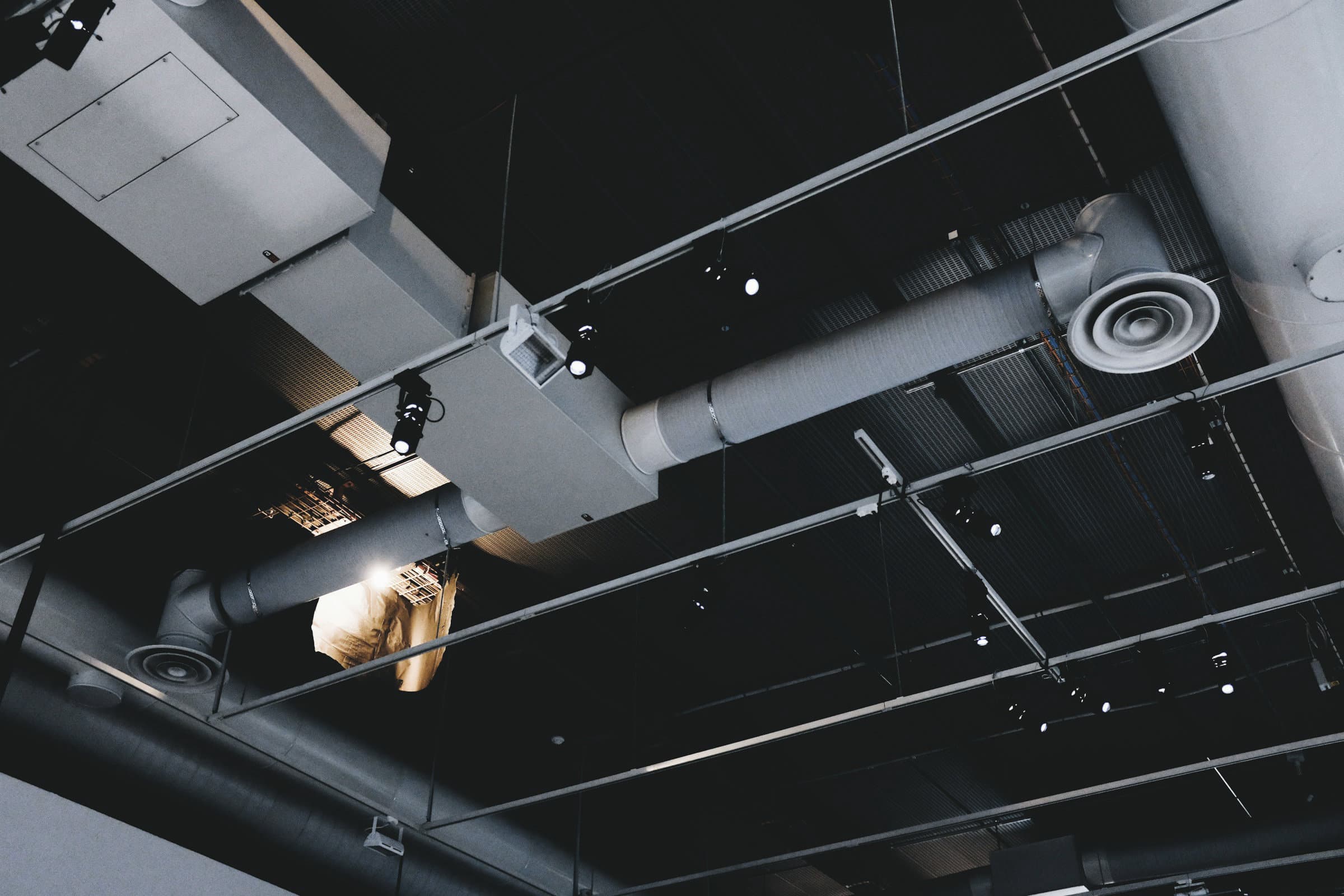 Ductwork with branch takeoffs running through a ceiling void