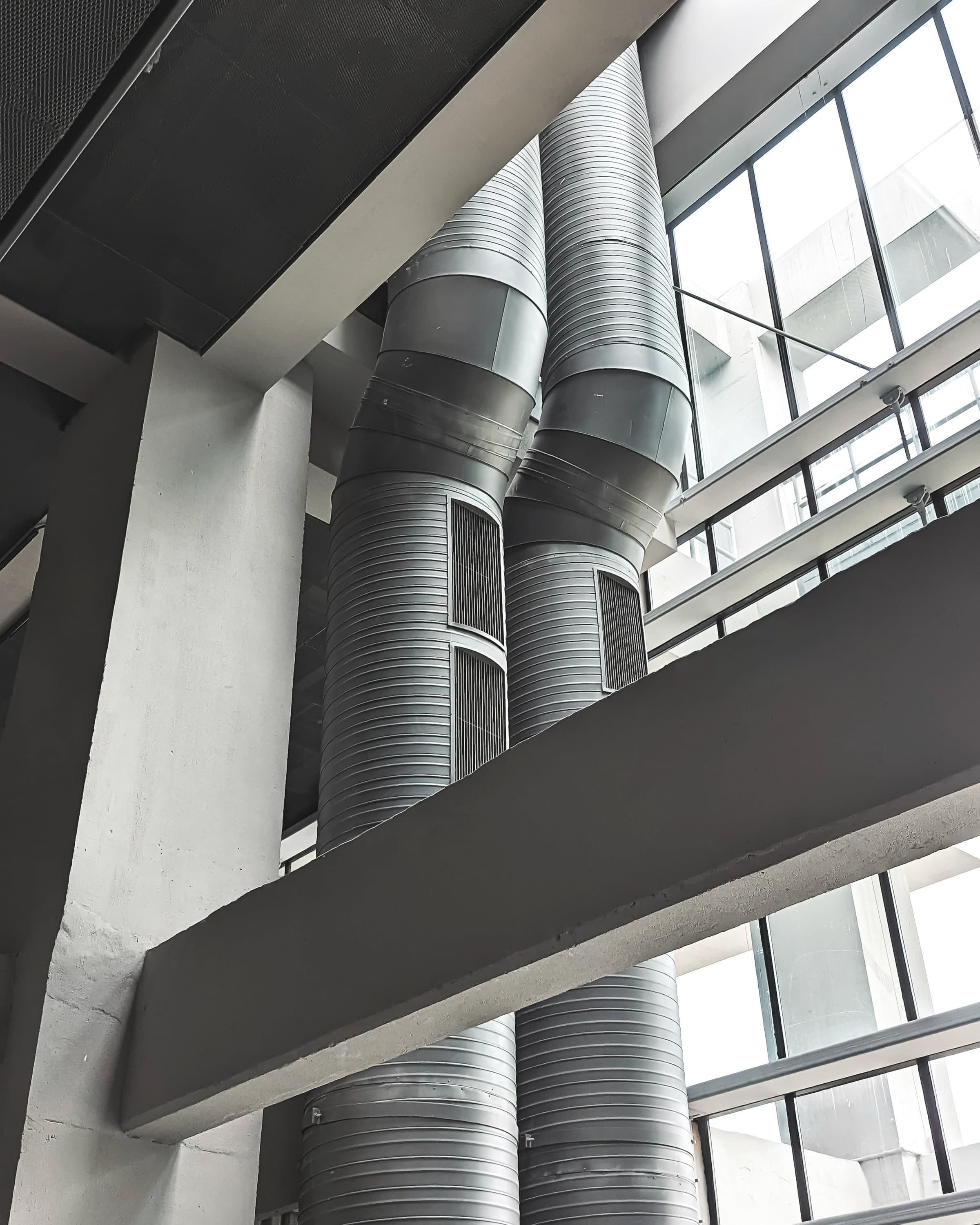 Ceiling mounted evaporators and ductwork above racking aisles
