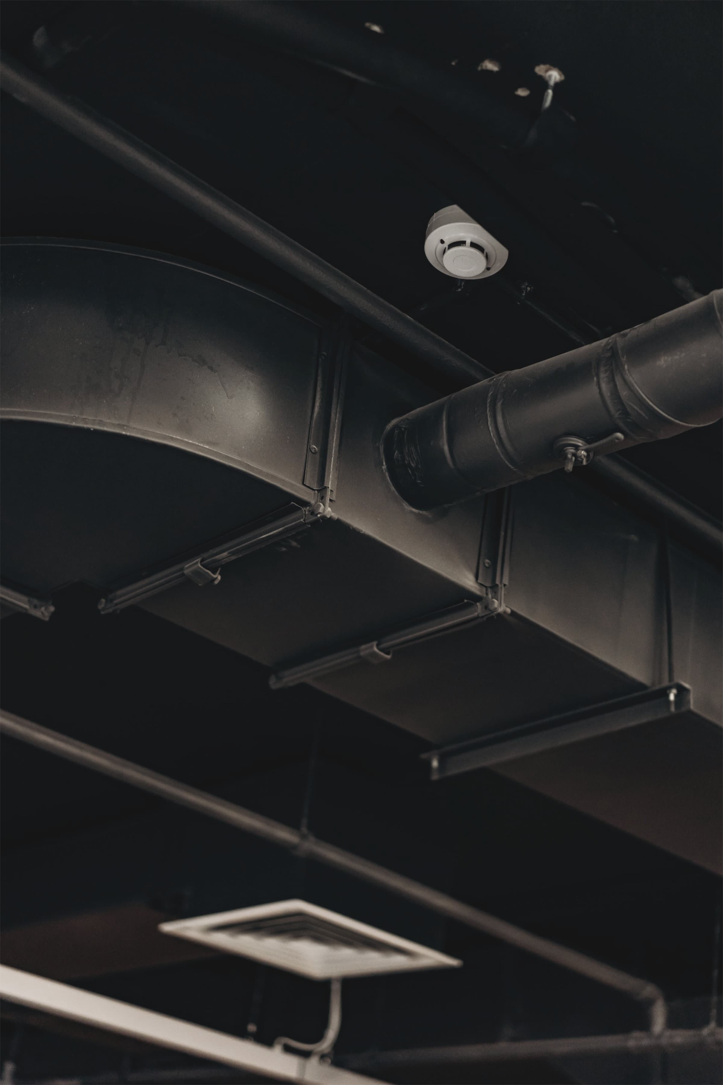 Pipework risers on freestanding frames running vertically through a services shaft