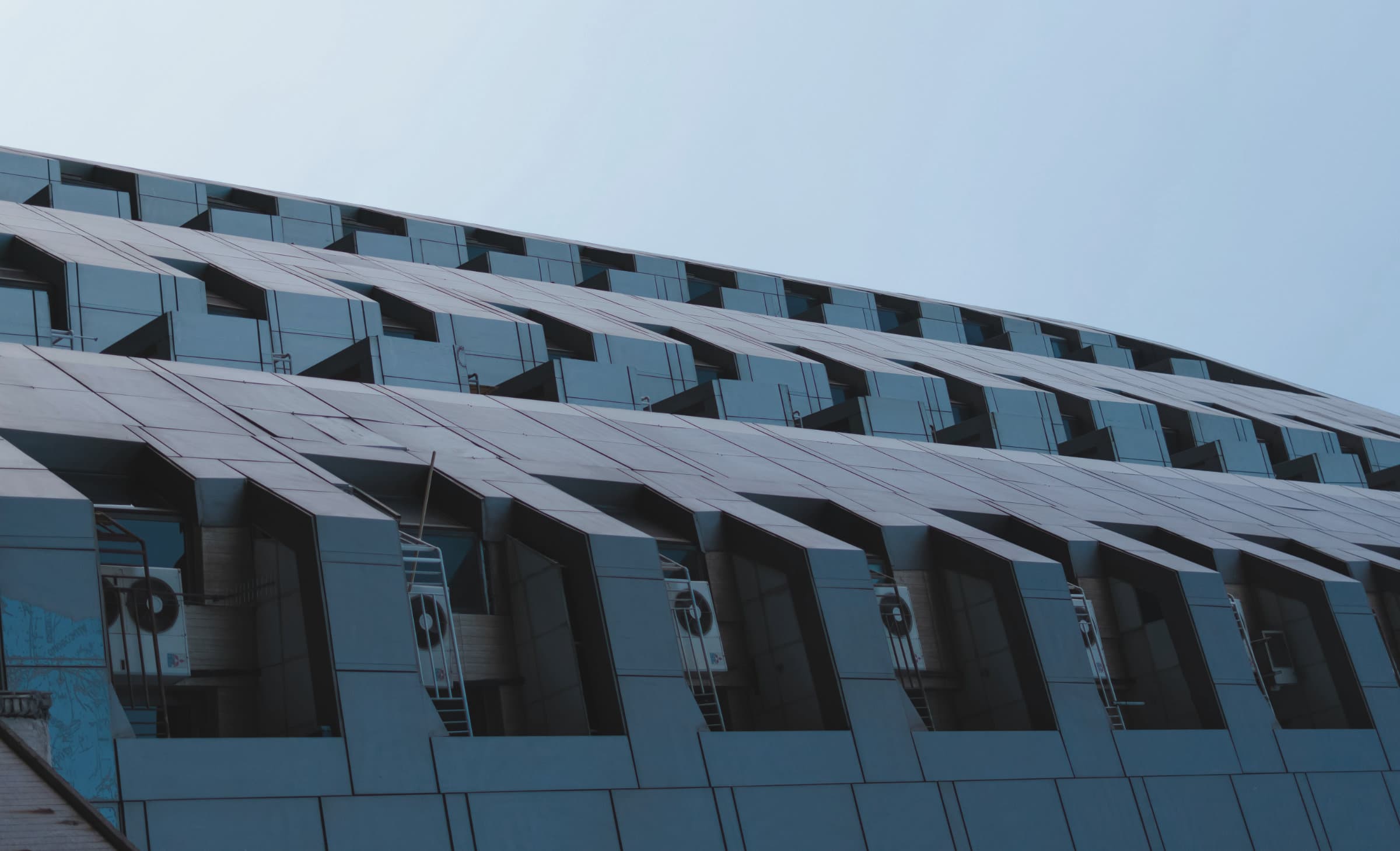 Exhaust fans and discharge stacks on a commercial roof