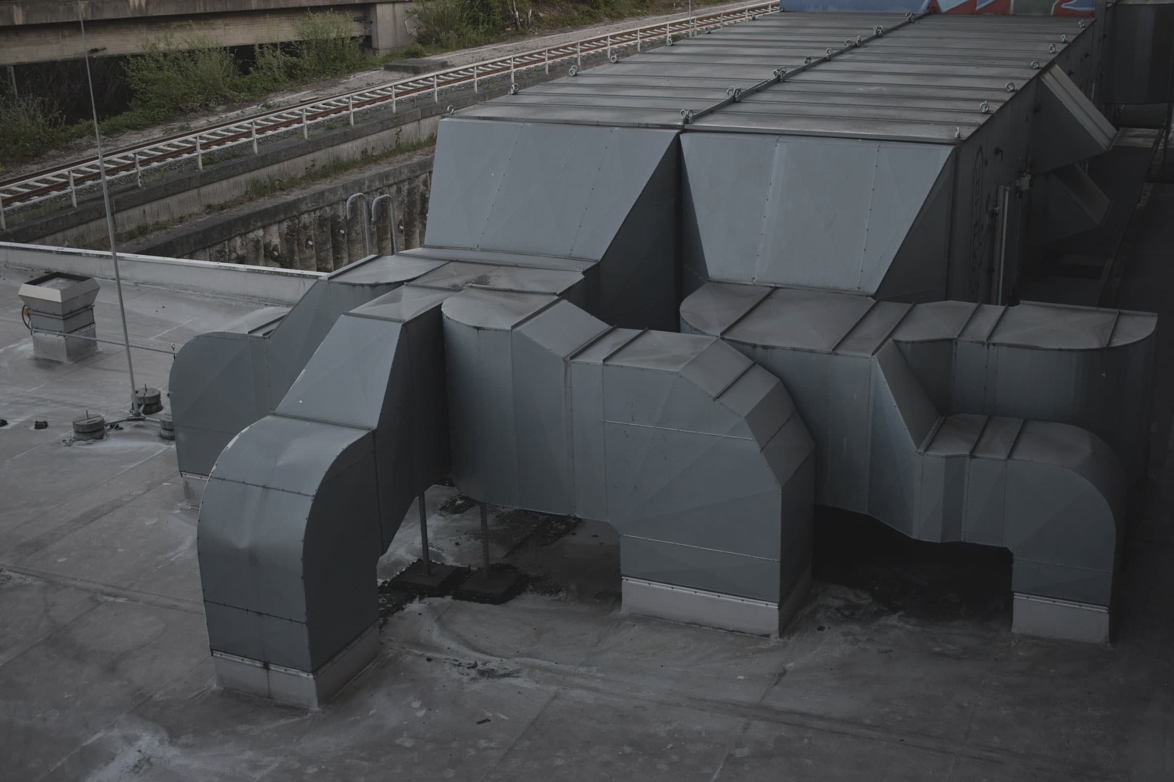 Roof mounted packaged units on plinths above a commercial roof